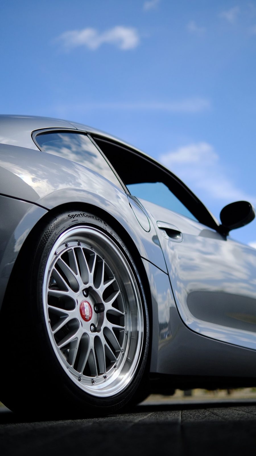 Mesh wheel on a grey Z4 Coupe against a blue sky